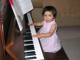 girl playing piano