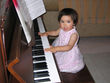 a girl playing piano